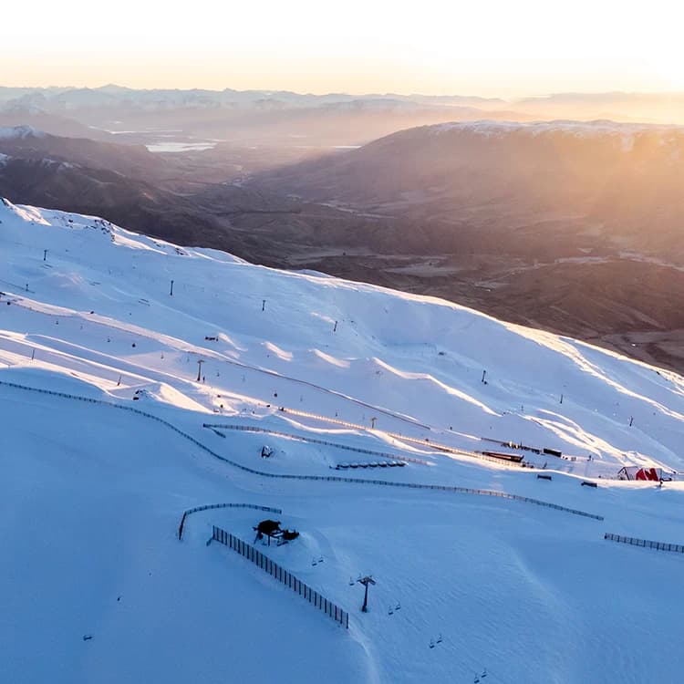 A drone shot of Cardrona Alpine Resort at sunrise.