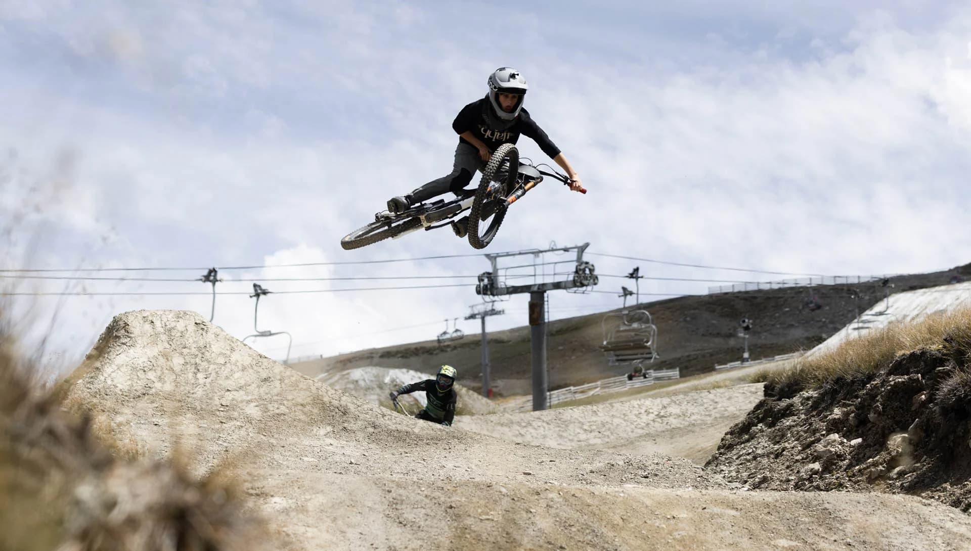 A person whips there bike to the side as the do a jump in the Cardrona bike park.