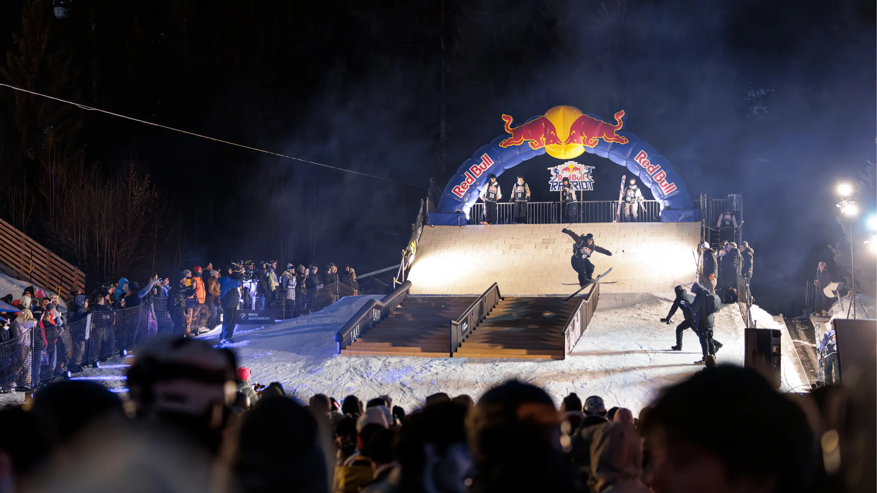 Outdoor rail jam event, sponsored by Red Bull, in the evening.