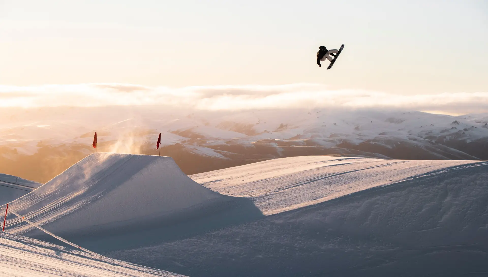New Zealand snowboarder, Zoi Sadowski-Synnott performs a jump in Cardrona Parks' Antlers Alley.