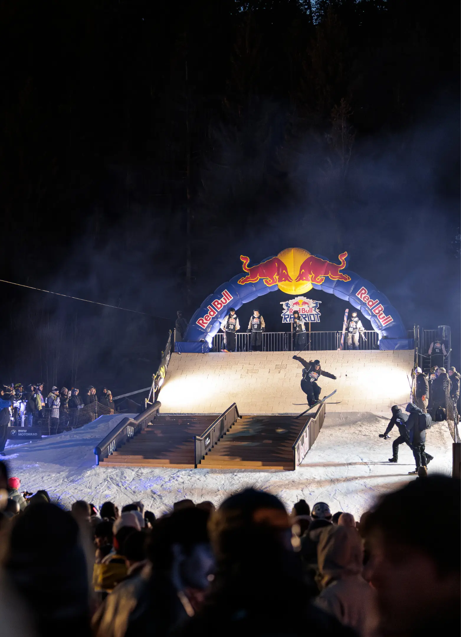Outdoor rail jam event, sponsored by Red Bull, in the evening.