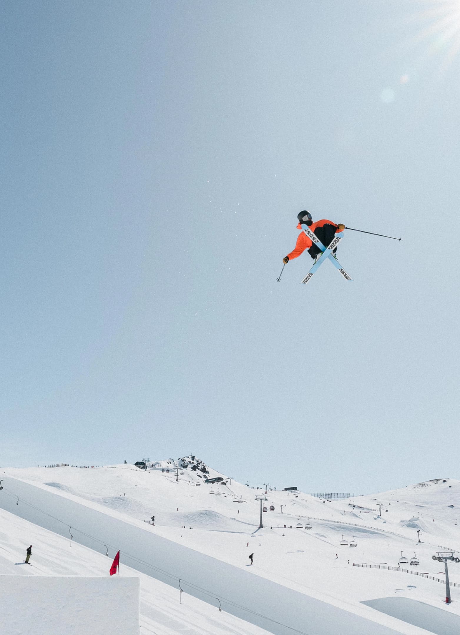 Freestyle skier mid-air performing a trick at the Jossi Wells Invitational at Cardrona.